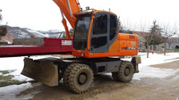 Аренда экскаватора колесного Doosan DX170